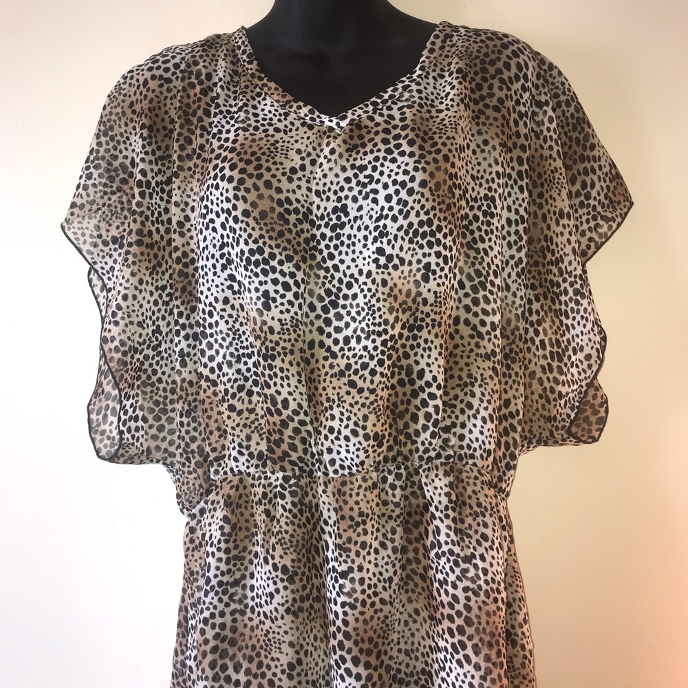 Miken animal print sheer peplum blouse M